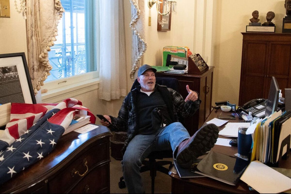 CAPITOL PROTESTOR WHO WAS PHOTOGRAPHED IN NANCY PELOSI’S OFFICE, AWAITING TRIAL