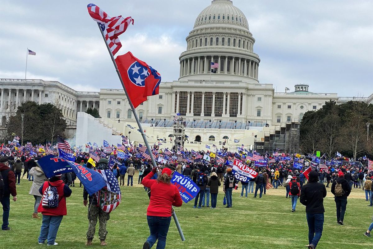 MAN CAPTURED BREAKING WINDOWS DURING CAPITOL RIOTS ARRESTED